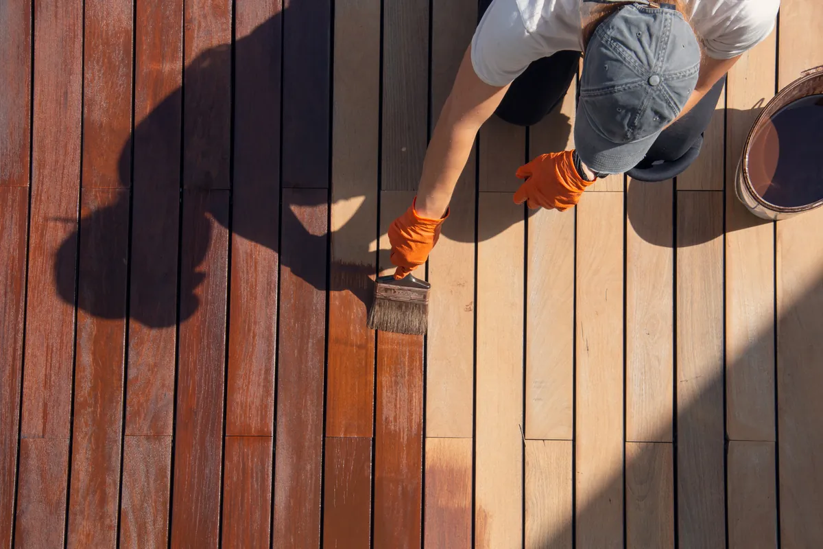 Hand-applied stain, board by board