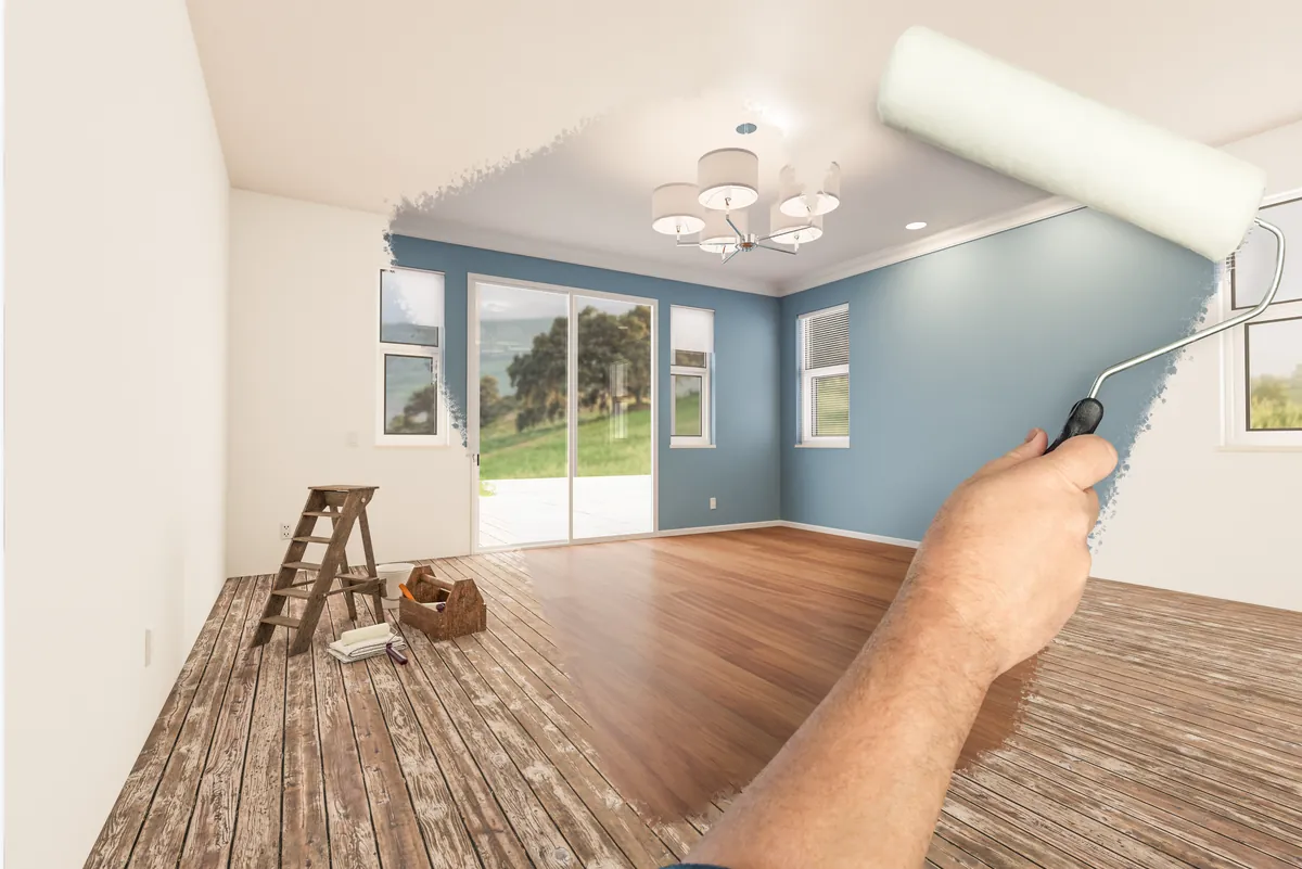 Interior repaint in progress — fresh color going onto a living room wall